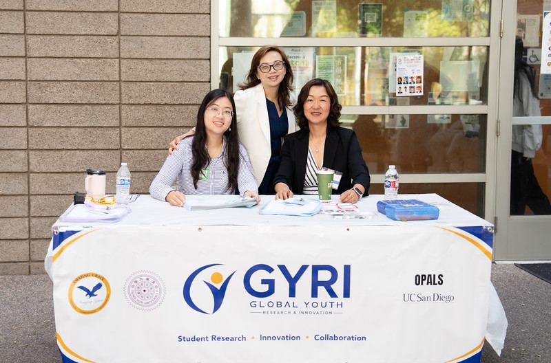 Registration check-in table with the GYRI banner