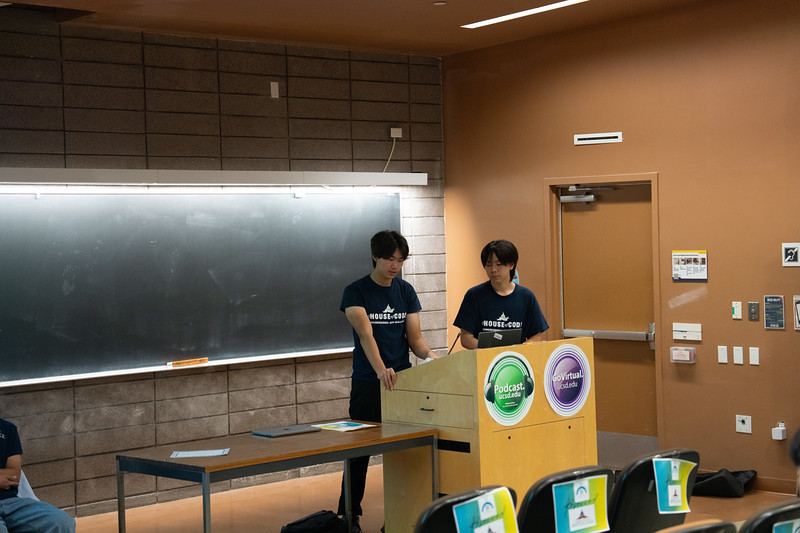 Student presenting research on stage